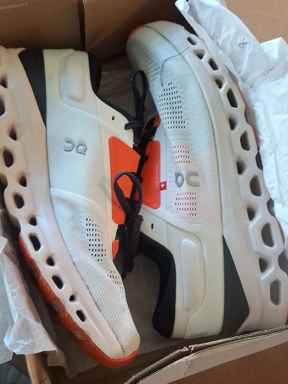 On Running Men’s White & Orange Cloudmonster Athletic Shoes